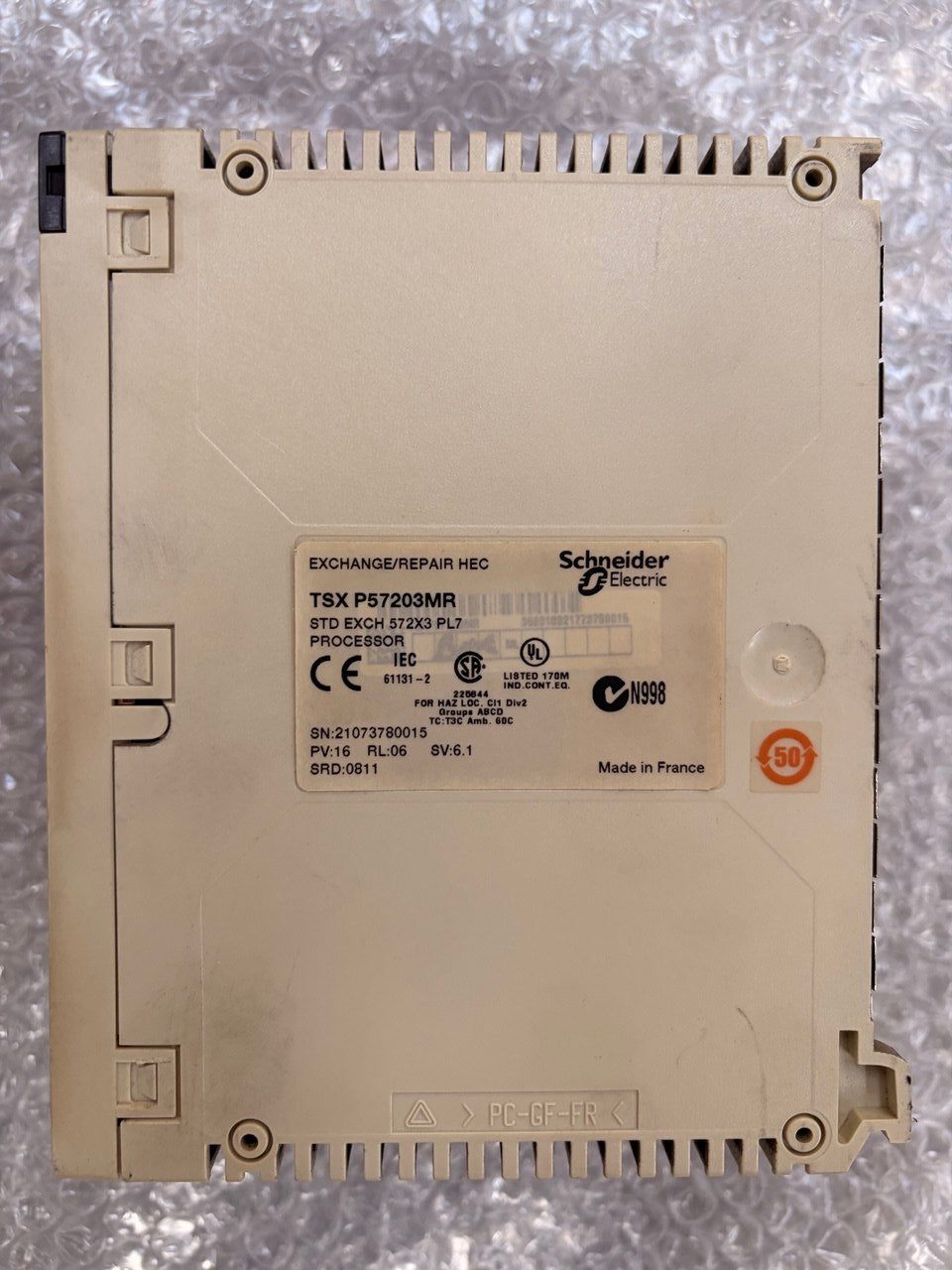 A Siemens industrial electronic module, specifically an EXO-MANDIR repair unit, shown from the back on a textured gray background.