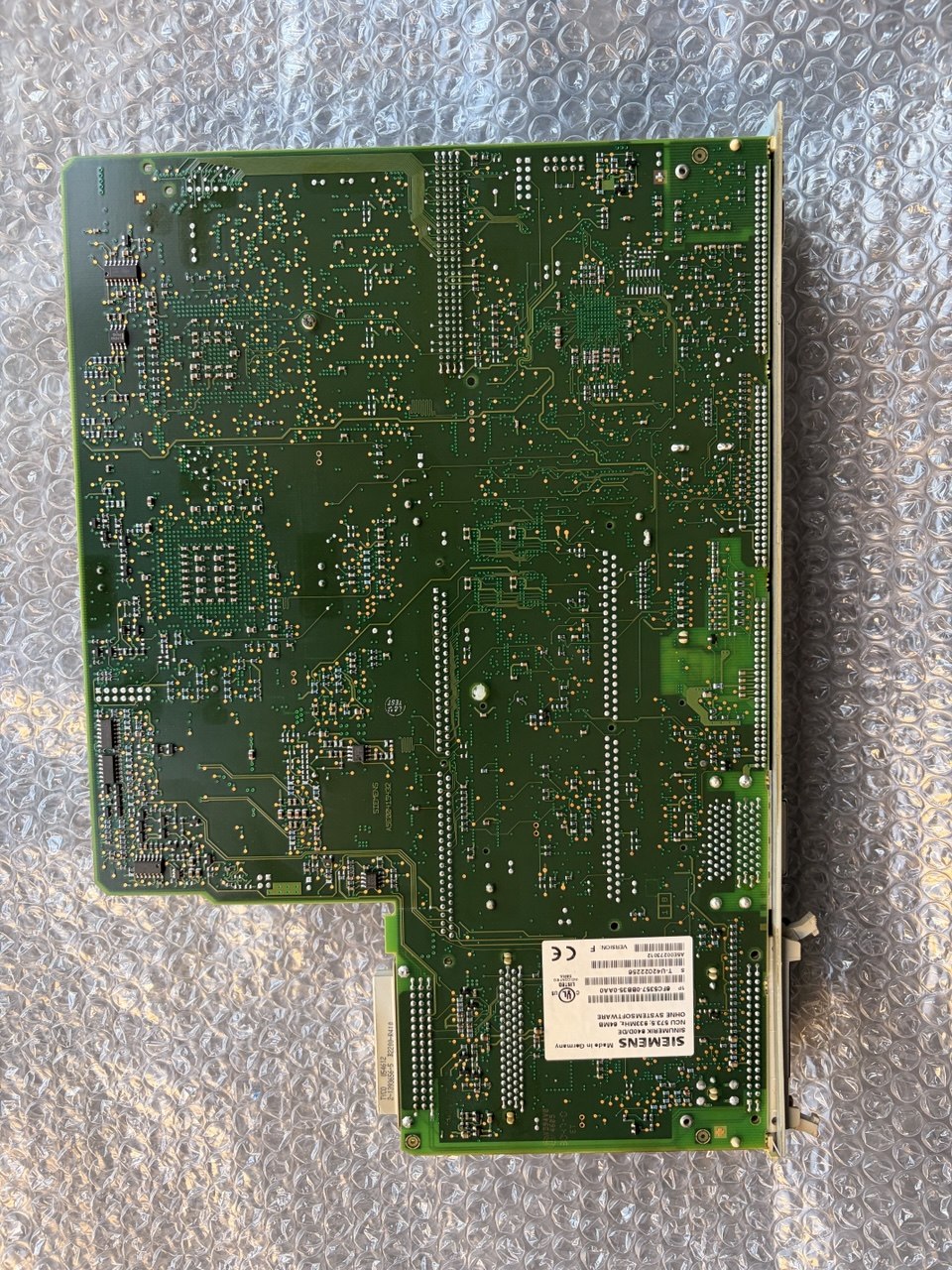 Siemens NCU 840D Green circuit board on a metallic surface