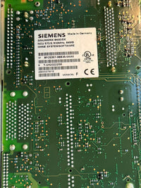 Close-up of a Siemens NCU Sinumerik electronic circuit board with various components.