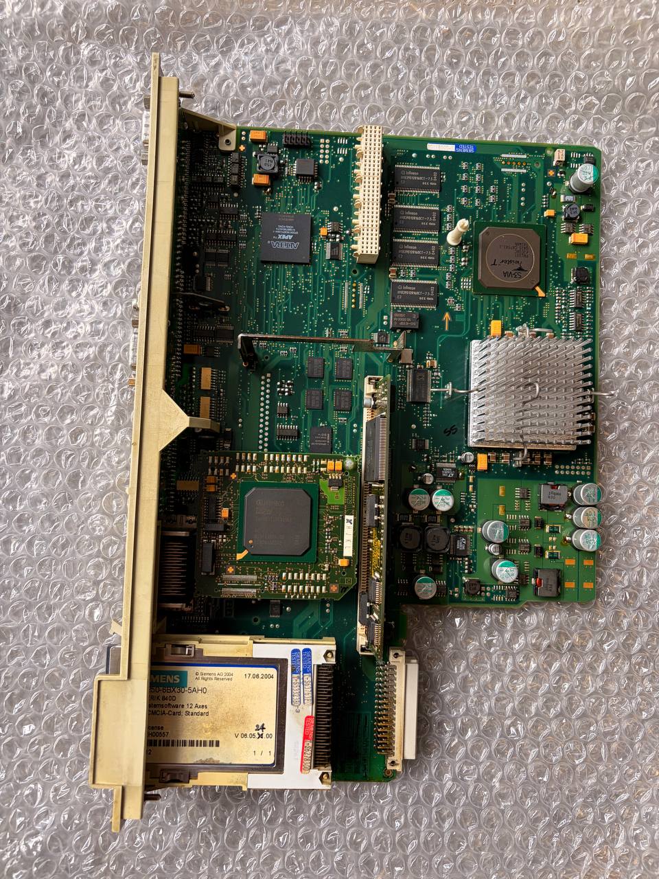 Siemens Computer motherboard on a textured gray surface
