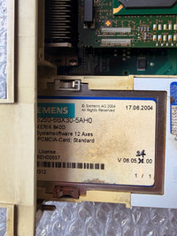 Close-up of a Siemens electronic component with a label on a metallic surface.