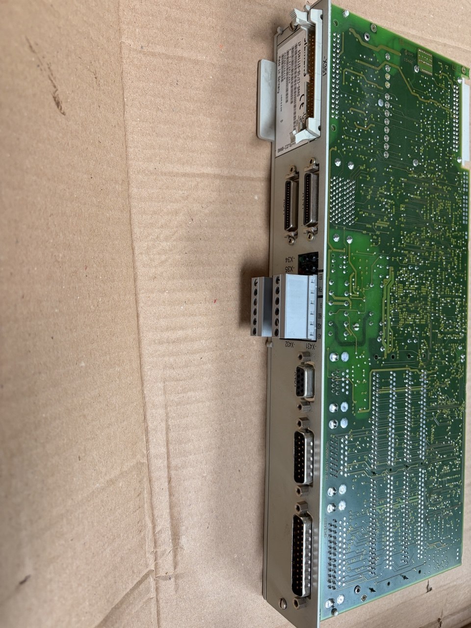 Electronic circuit board with connectors on a cardboard background