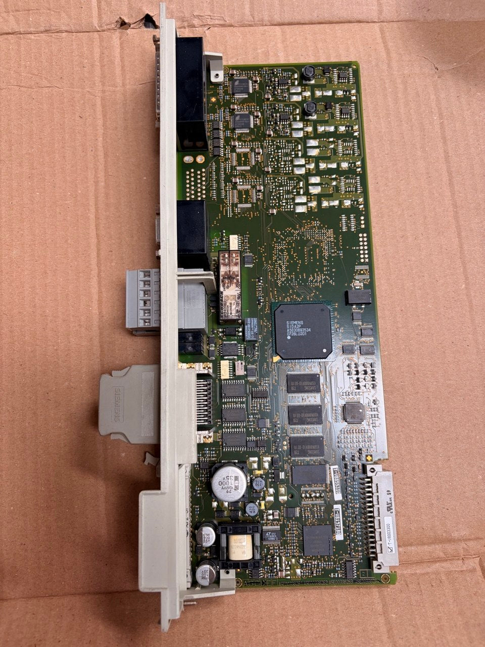 Electronic circuit board on a cardboard surface