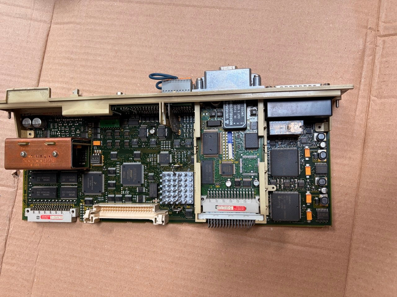 Siemens Electronic circuit boards on a cardboard surface