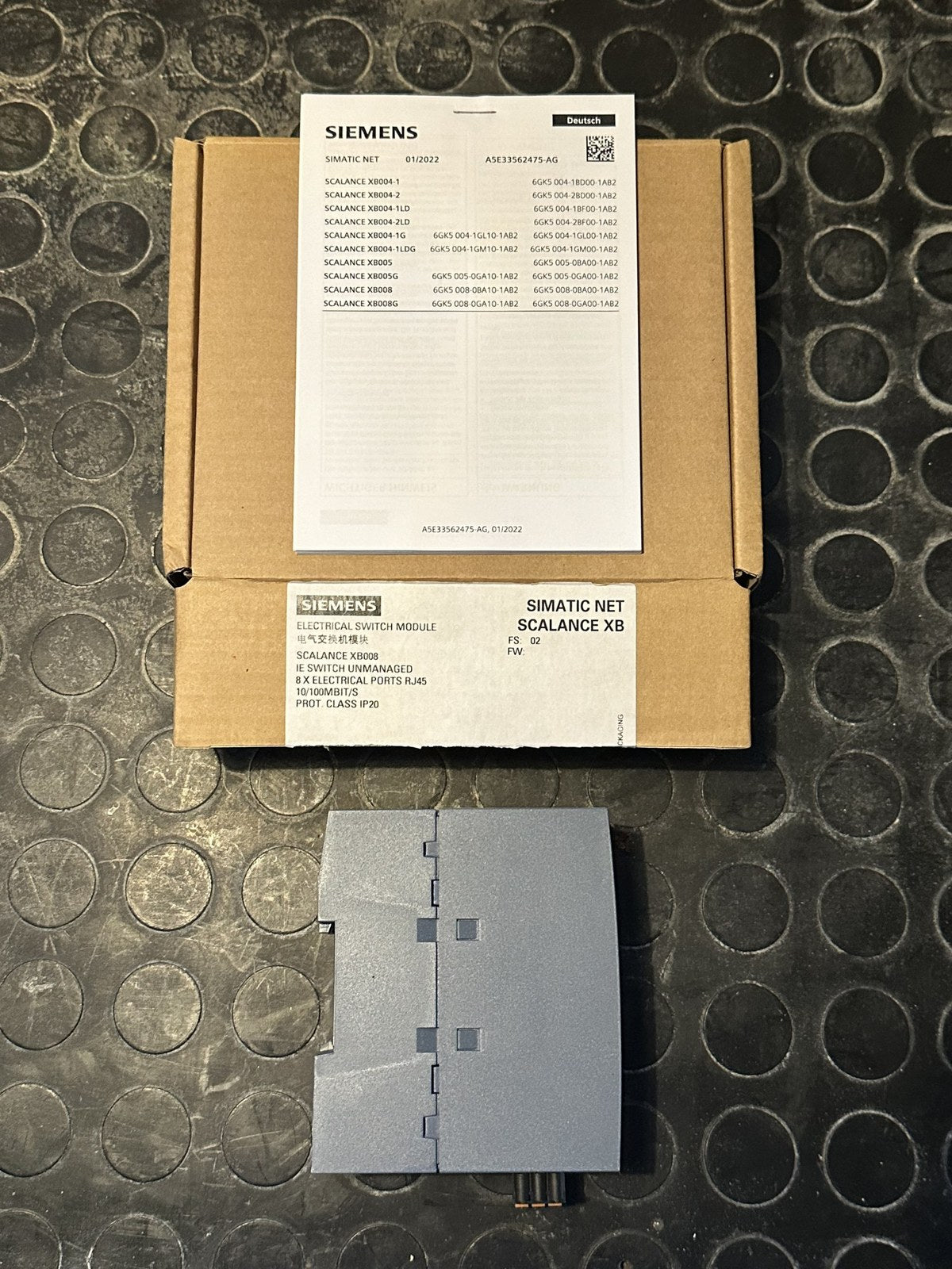 Siemens SCALANCE XB008 switch, rear view, with original box