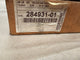 Close-up of a cardboard box with a label featuring a barcode and text.