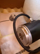 Heidenhain ROD 446 360-Close-up of a black and silver motor on a cardboard surface