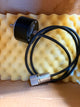 Heidenhain ROD encoder- Black cable with metal connectors on a yellow foam block