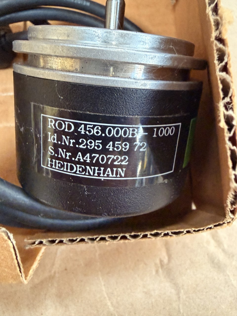 Mechanical component with a label on a cardboard background