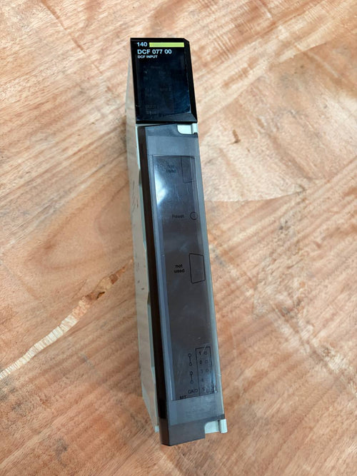 Electronic device with a screen on a wooden surface