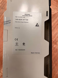 Time Sync Input Module with Schneider branding on a wooden surface