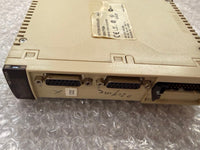 A vintage beige industrial electronic module with DVI and VGA connectors, resting on bubble wrap packaging.
