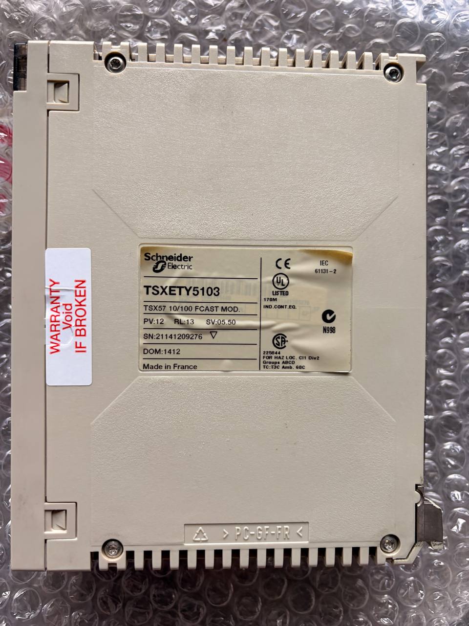 Schneider Electric industrial component on a metallic surface