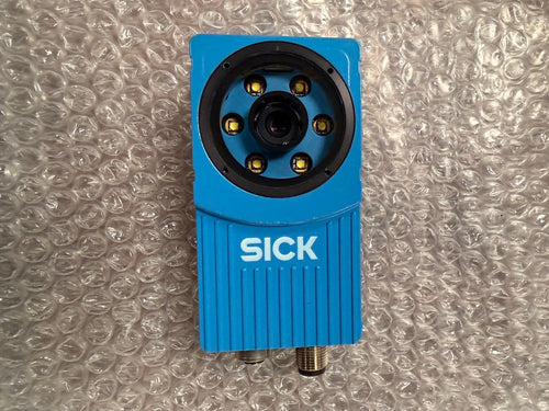 Blue sensor with 'SICK' branding on a bubble wrap background