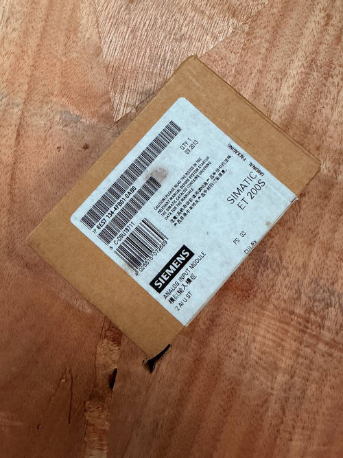 Cardboard box with a Siemens label on a wooden surface