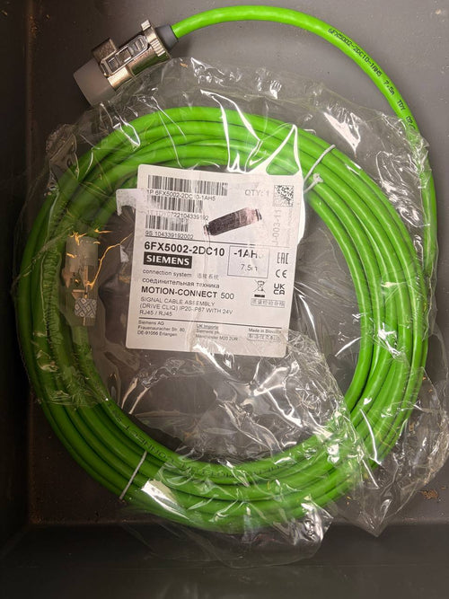 Green cable with Siemens label on a dark surface