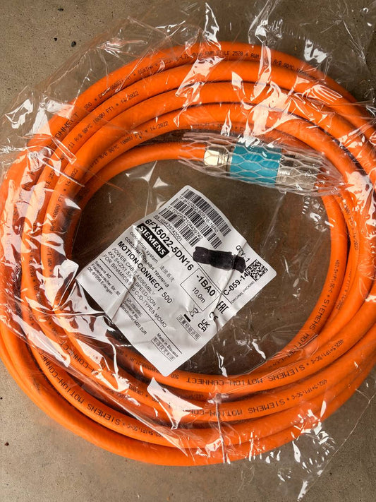 Siemens Motion connect Orange cable with labels on a clear plastic wrap against a brown background
