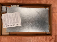 Metal panel with text and symbols in a wooden box