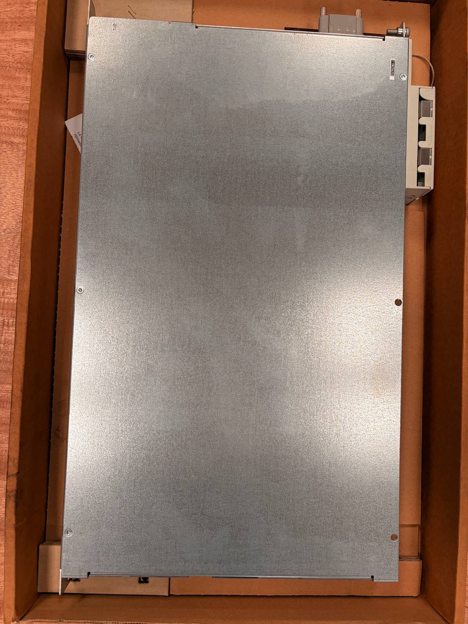 Metal panel inside a wooden cabinet