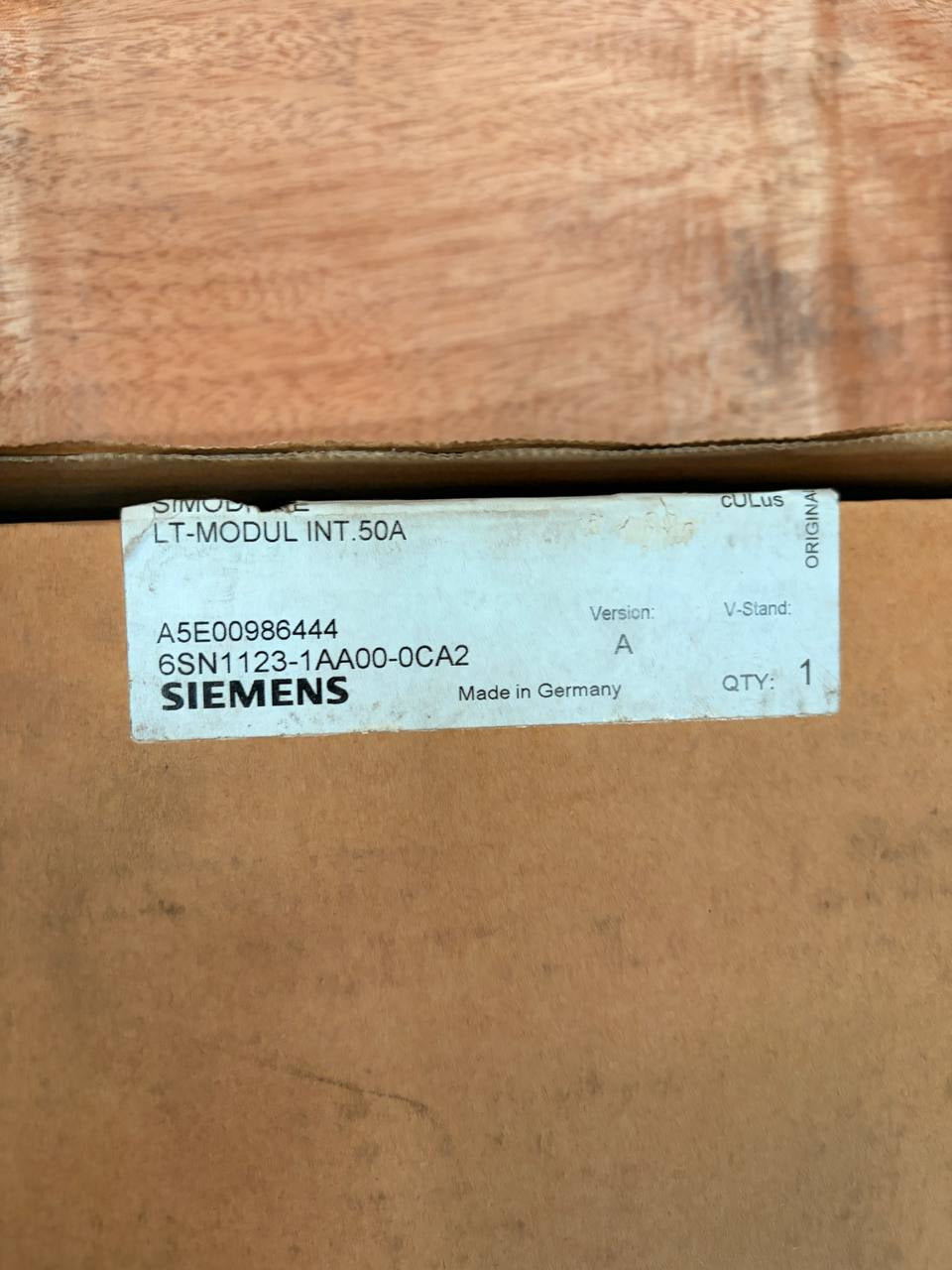 Siemens label on a cardboard box with a wooden surface below