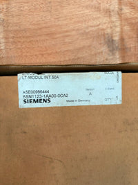 Siemens label on a cardboard box with a wooden surface below