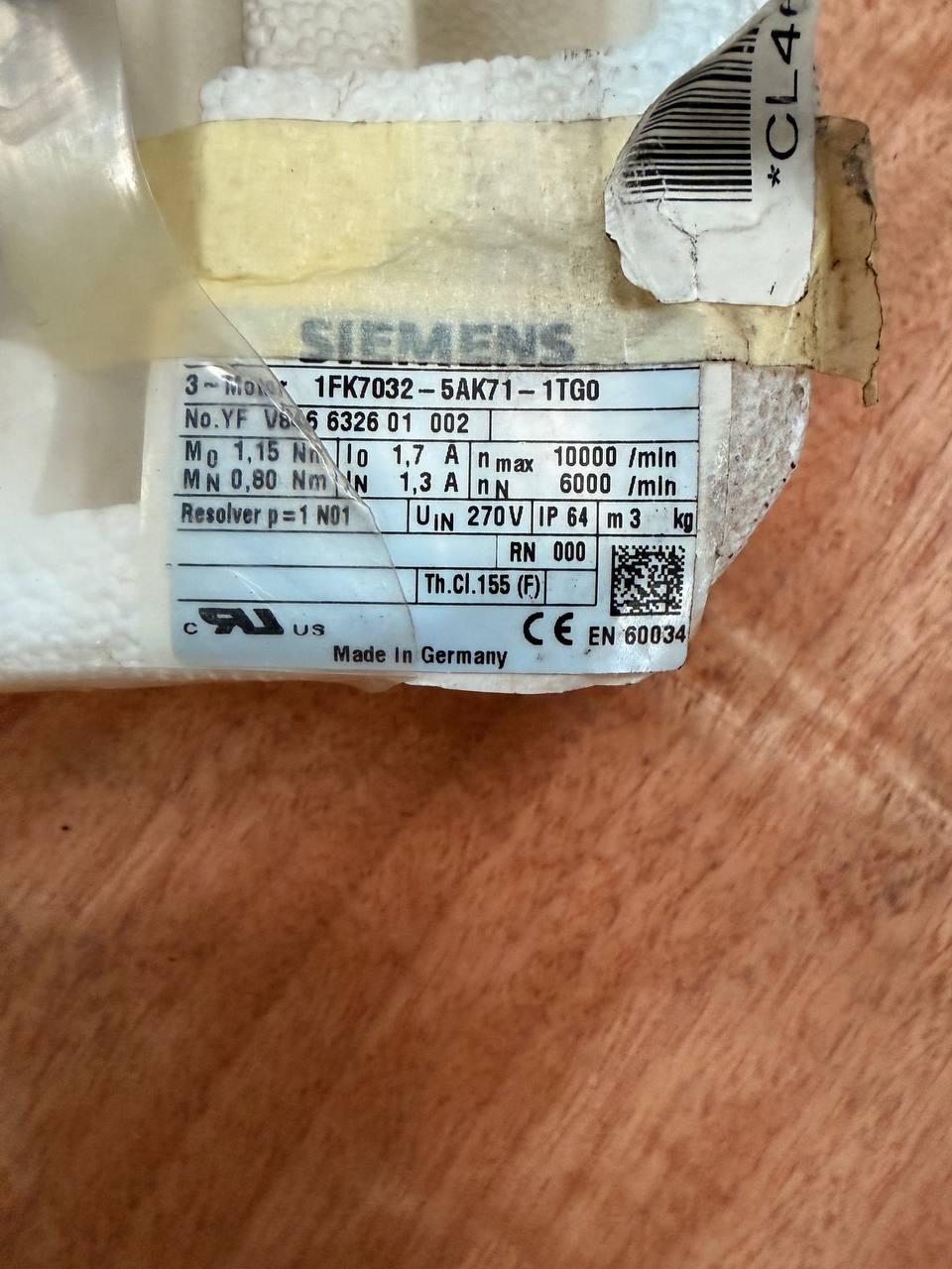 Siemens motor packaging with label on a wooden surface