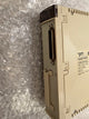 Schneider Electric TSXSCY216001 industrial electronic module in beige plastic, photographed on bubble wrap packaging.