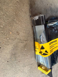Packaged item with a radiation warning label on a concrete surface