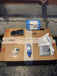 SICK GL10G-P4252 sensor, side view, with original box and carton of stock