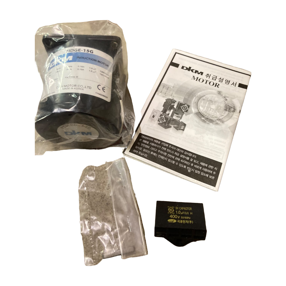 Surplus lot: DKM 7IDGE-15G 15 W induction motor with 1.0 µF capacitor, parts bag and manual