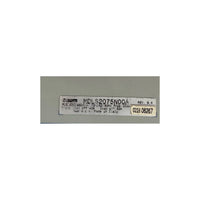 A NUM white rectangular product label with black printed text and a yellow serial sticker, placed on a gray background.